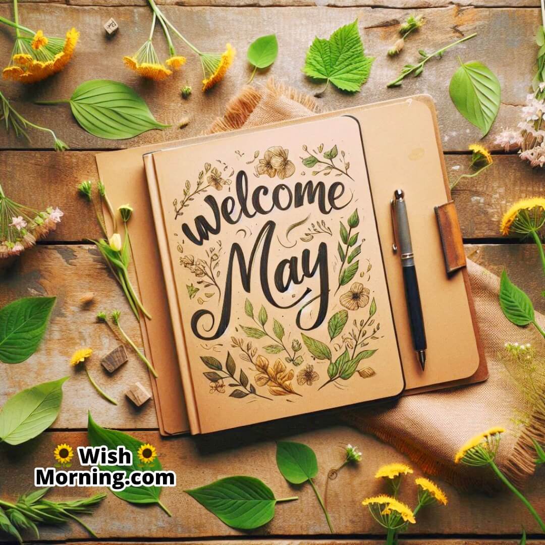 Artistic journal with handwritten Welcome May text in a spring-themed setting.