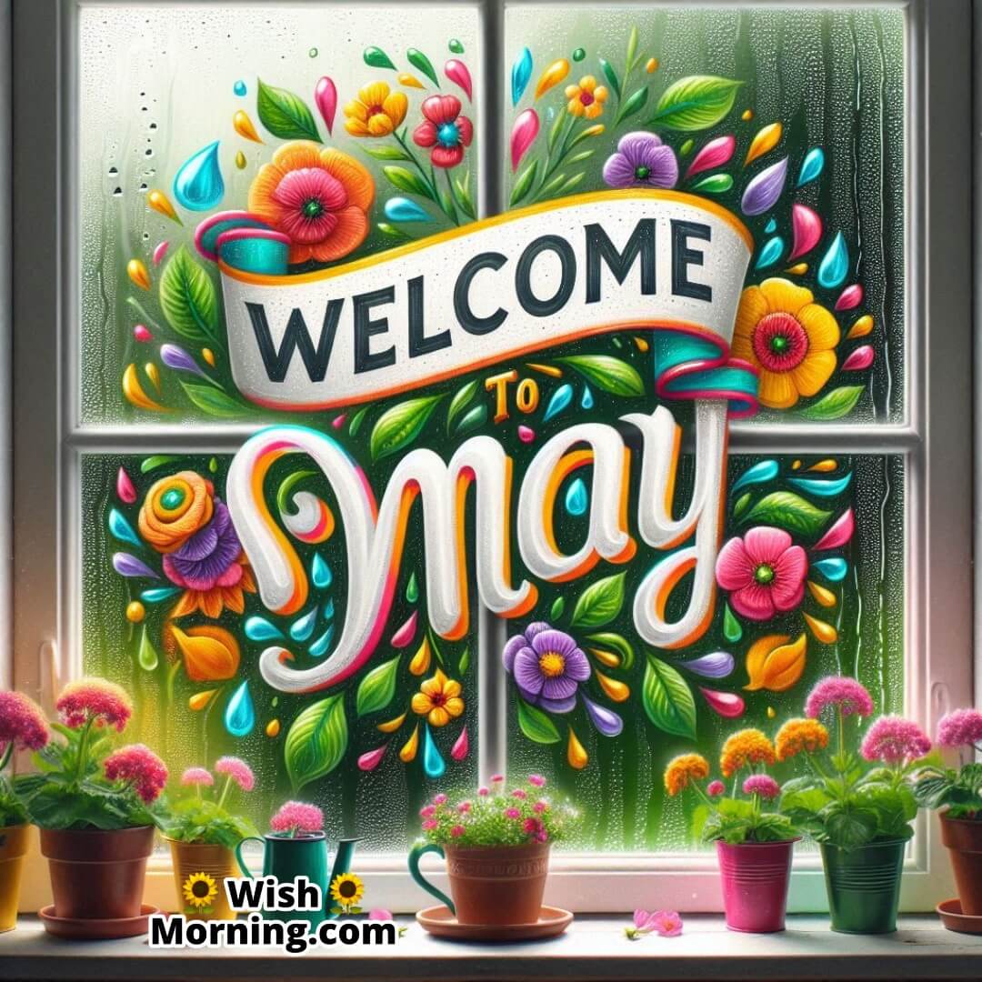 Painted Welcome May message on a rainy window with spring flowers.