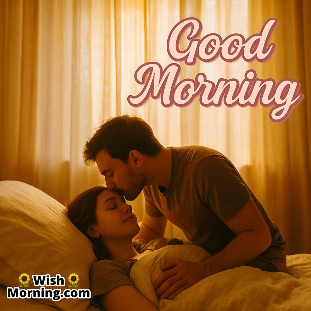 Forehead Kiss Good Morning Pic For Romantic Start image featuring a gentle forehead kiss in bed, symbolizing tenderness and affection.