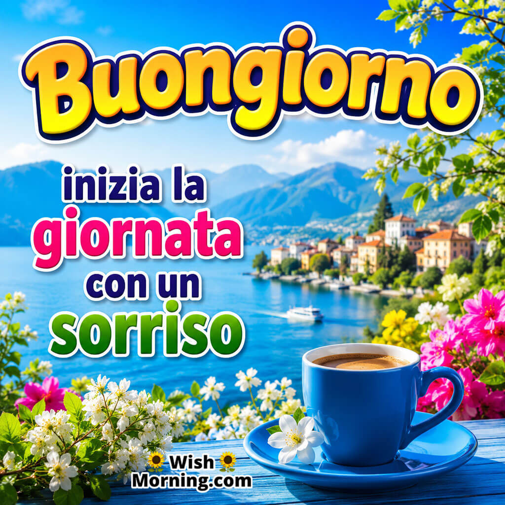Buongiorno Smile Wish Image featuring a steaming blue coffee cup, colourful flowers, a peaceful lakeside view and mountains symbolising a cheerful start to the day.