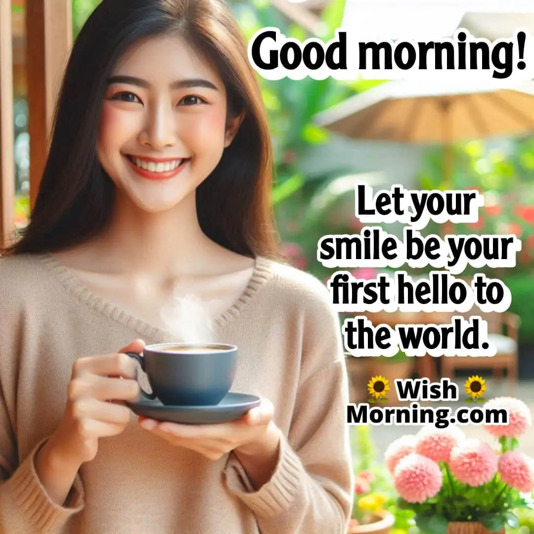Person standing holding a cup of cooffee with a bright smile,