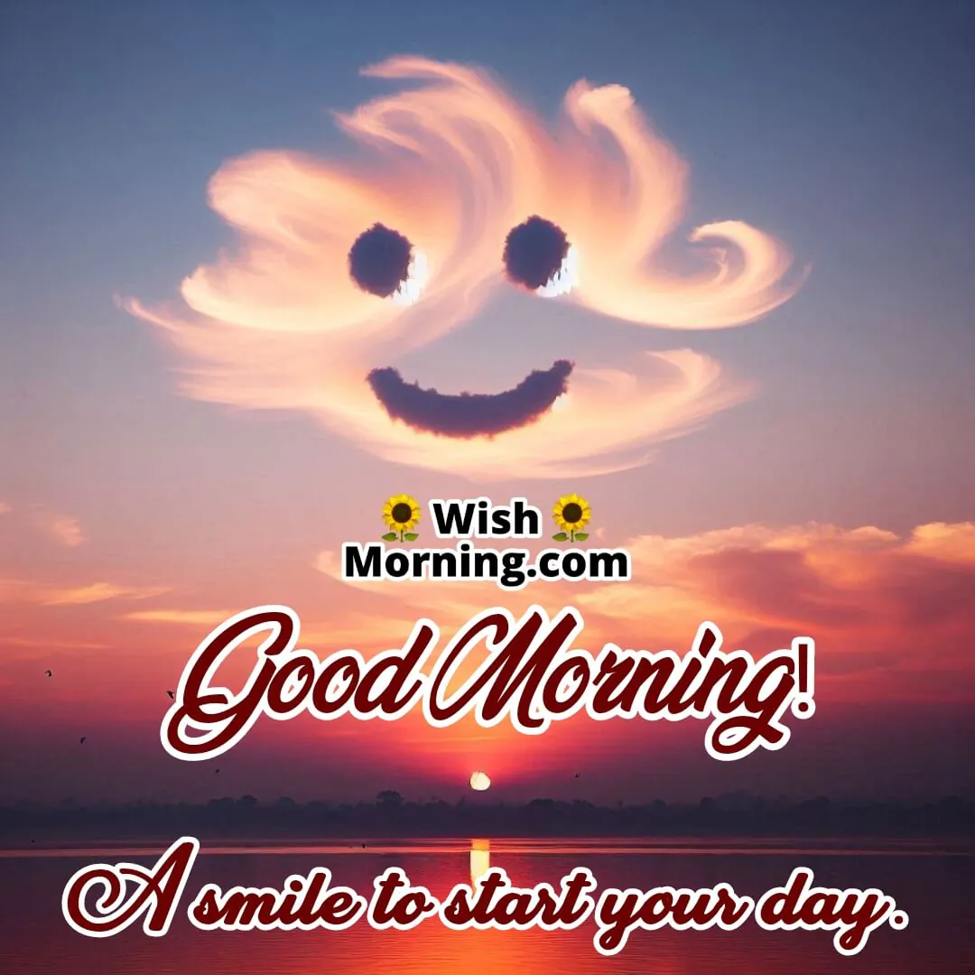Sunrise over a calm landscape with clouds shaped into a smiley face, casting a joyful expression with birds flying in the distance.